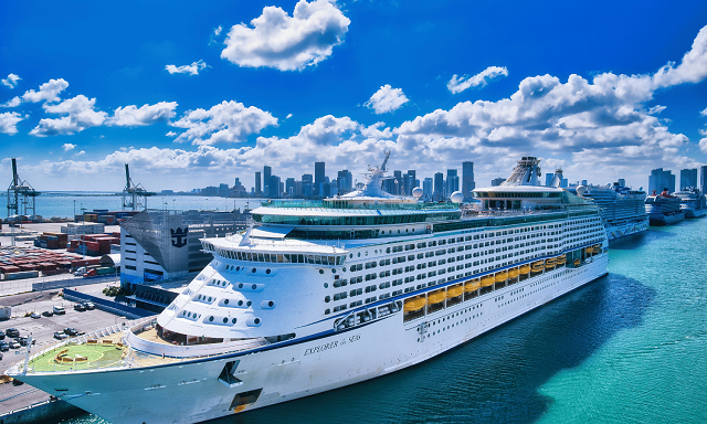 a cruise ship docked in a city
